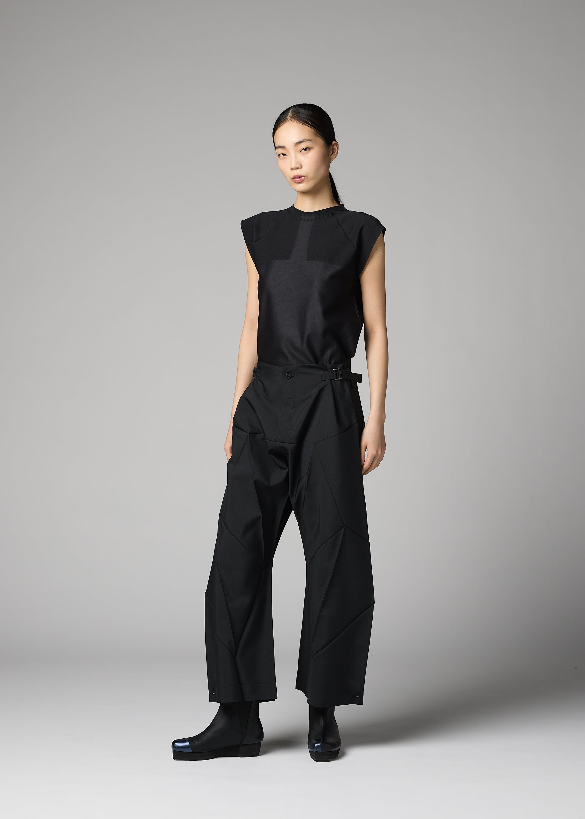 A model wears the 132 5. ISSEY MIYAKE F-BT f-bt-trousers-black.