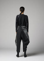 A model wears the 132 5. ISSEY MIYAKE F-BT f-bt-trousers-black-x-silver-1.
