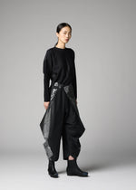 A model wears the 132 5. ISSEY MIYAKE F-BT f-bt-trousers-black-x-silver-1.