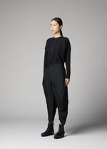 A model wears the 132 5. ISSEY MIYAKE F-BT f-bt-trousers-black-1.