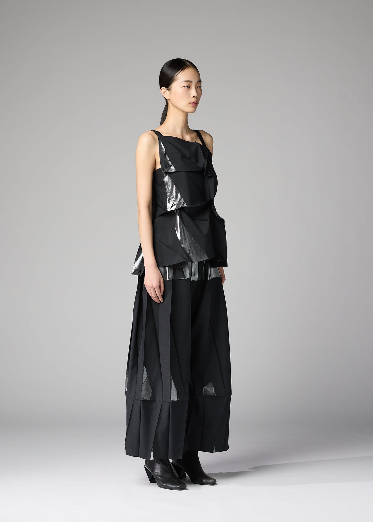 A model wears the 132 5. ISSEY MIYAKE No.1-1 shirt.