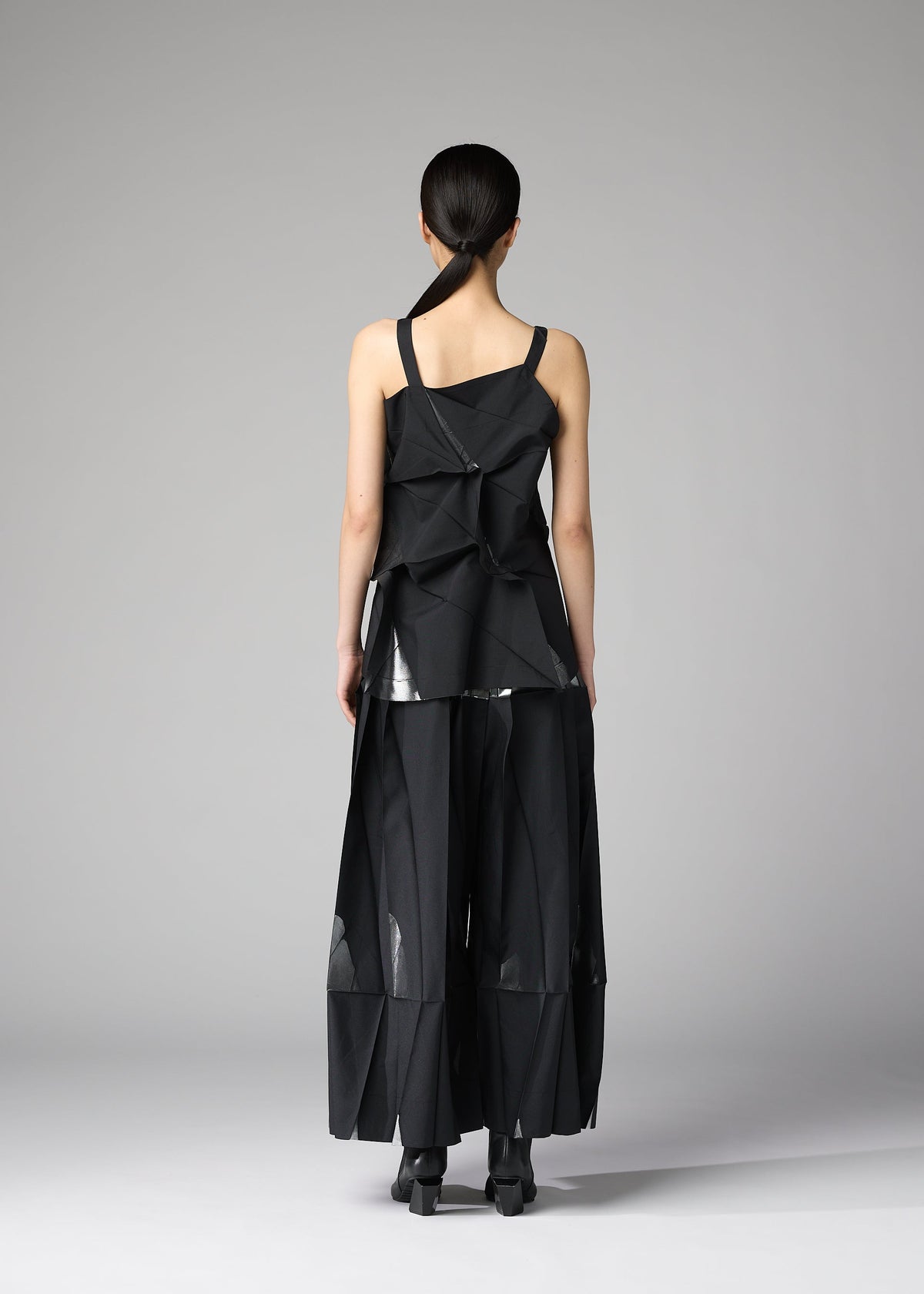 A model wears the 132 5. ISSEY MIYAKE No.1-1 shirt.