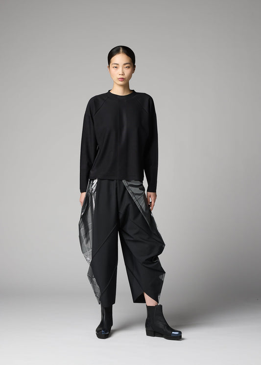 A model wears the 132 5. ISSEY MIYAKE F-KN f-kn-top-black-1.