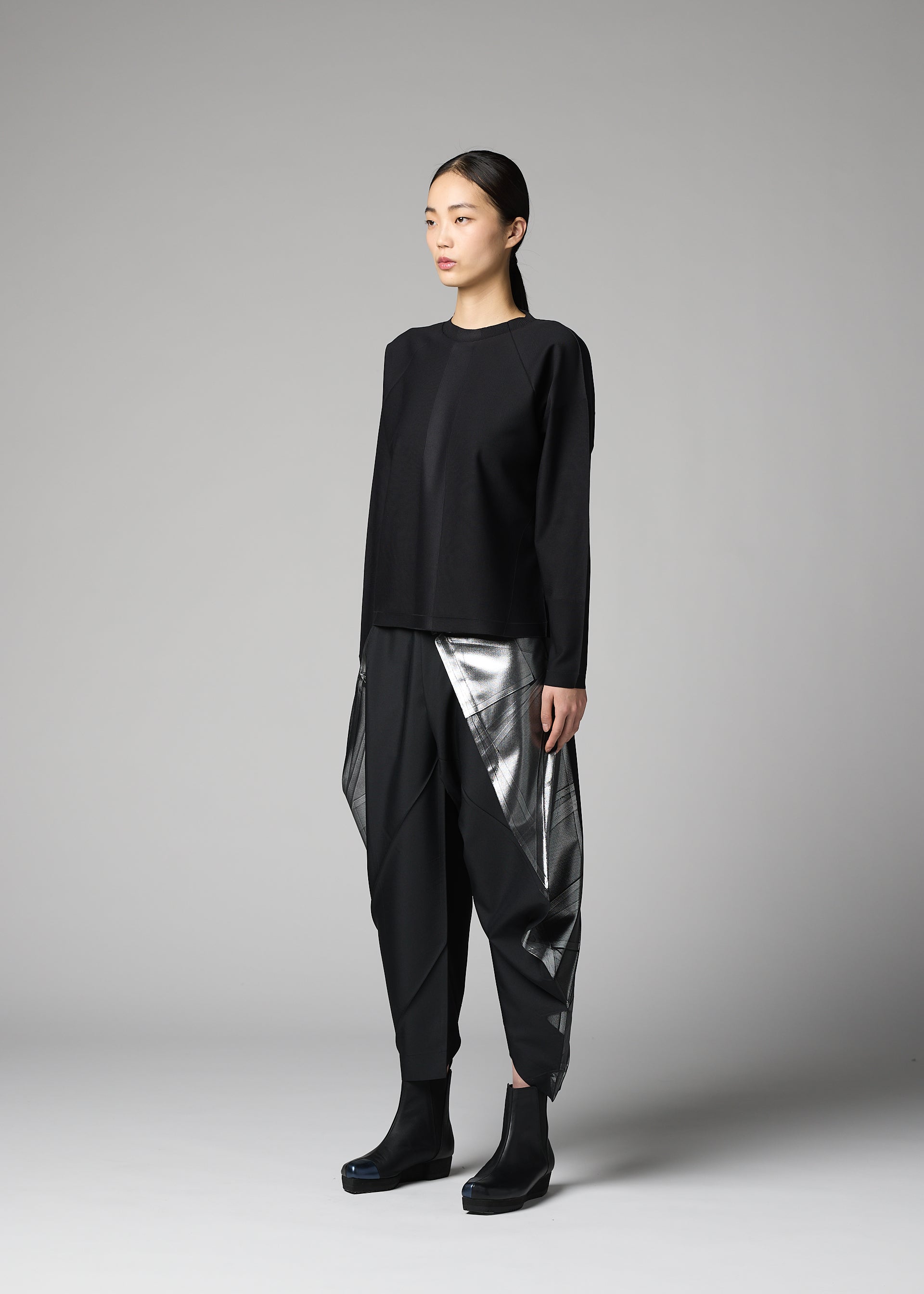 A model wears the 132 5. ISSEY MIYAKE F-KN f-kn-top-black-1.