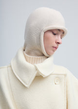 A model wears the ISSEY MIYAKE CHUNKY WOOL ACC hat.