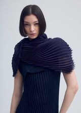 A model wears the ISSEY MIYAKE  SILK WOOL PLEATS STOLE stole