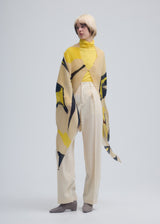 A model wears the ISSEY MIYAKE VIGOR PLEATS STOLE stole.