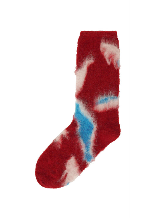 A product shot of the ISSEY MIYAKE VIGOR SOCKS socks in red-hued (27).