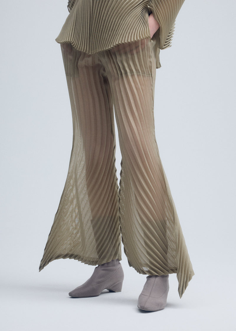 A model wears the ISSEY MIYAKE WANDER trousers.