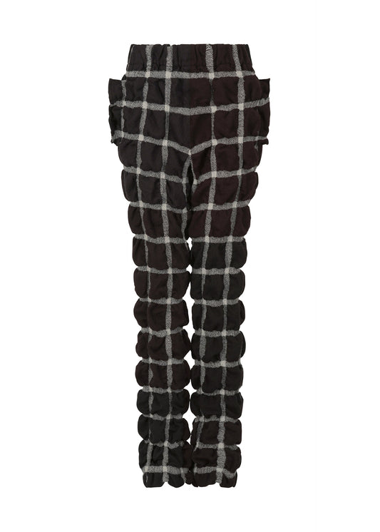 A product shot of the ISSEY MIYAKE PRISM CHECK trousers in black-hued (17).