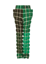 A product shot of the ISSEY MIYAKE PRISM CHECK trousers in green-hued (66).