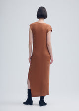 A model wears the ISSEY MIYAKE VIGOR PLEATS SOLID dress.