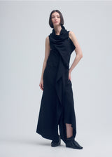 A model wears the ISSEY MIYAKE  ENCLOTHE PANTS jumpsuit