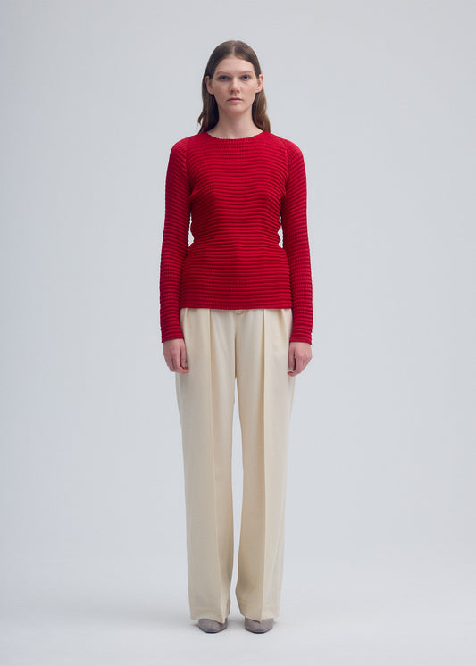 A model wears the ISSEY MIYAKE SUEDE LIKE PLEATS shirt.