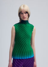 A model wears the ISSEY MIYAKE NUANCE PLEATS shirt.