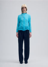 A model wears the ISSEY MIYAKE  CHIFFON TWIST 1 cardigan