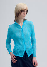 A model wears the ISSEY MIYAKE  CHIFFON TWIST 1 cardigan