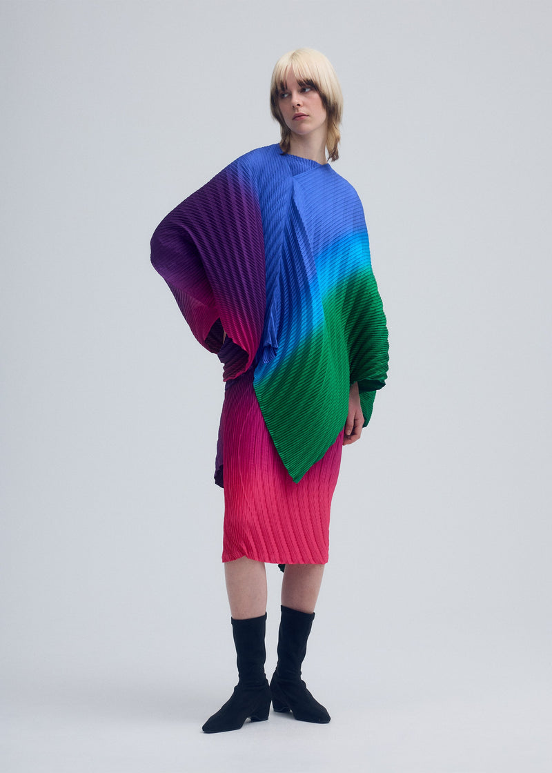 A model wears the ISSEY MIYAKE NUANCE PLEATS cardigan.