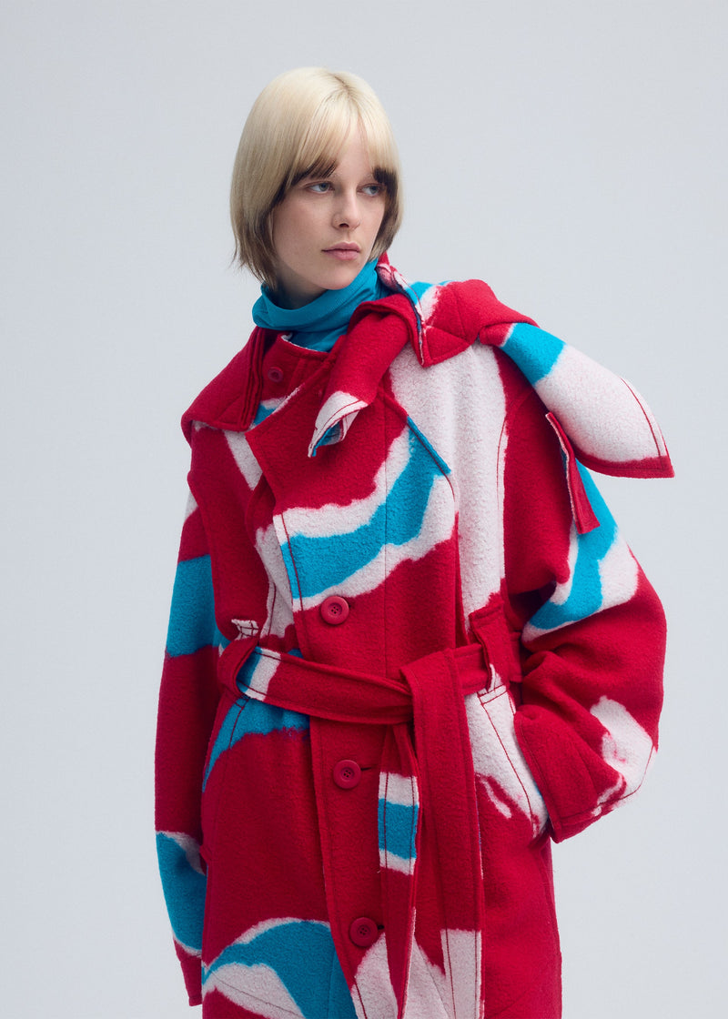 A model wears the ISSEY MIYAKE VIGOR coat.