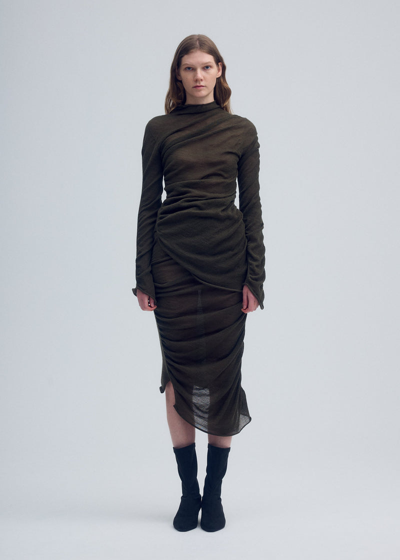 A model wears the ISSEY MIYAKE AMBIGUOUS WOOL skirt.