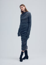 A model wears the ISSEY MIYAKE AMBIGUOUS WOOL tunic.