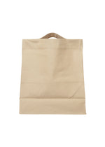 A detail shot of the ISSEY MIYAKE DRAWN AND PRESSED bag.