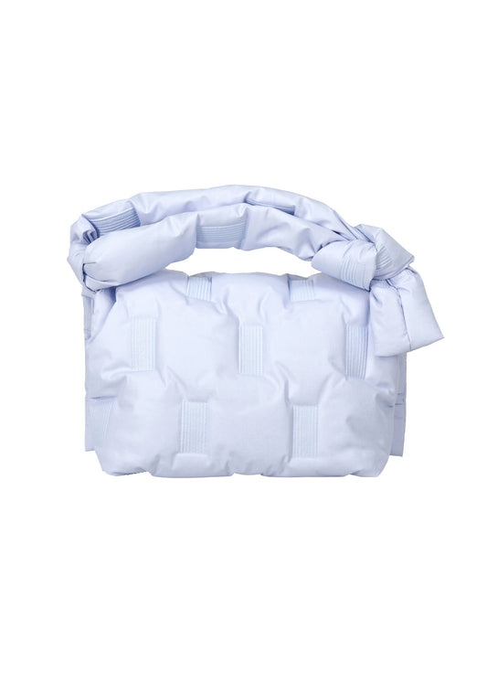 A detail shot of the ISSEY MIYAKE SQUARE CUSHION bag.