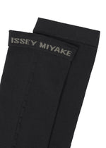 A detail shot of the ISSEY MIYAKE SHEER SOCKS socks.