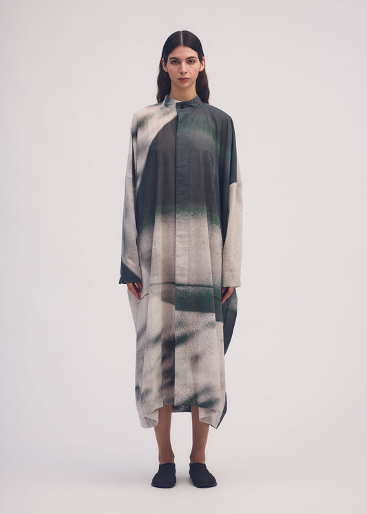 A model wears the ISSEY MIYAKE SHADOW STUDY coat.