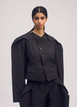 A model wears the ISSEY MIYAKE FOLD TO FORM jacket.