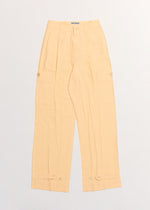 A detail shot of the ISSEY MIYAKE PRESSED FORM trousers.