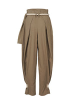 A detail shot of the ISSEY MIYAKE CLOTH AND CORD trousers.