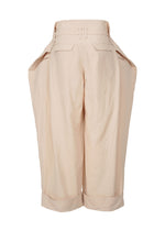 A detail shot of the ISSEY MIYAKE FOLD TO FORM trousers.