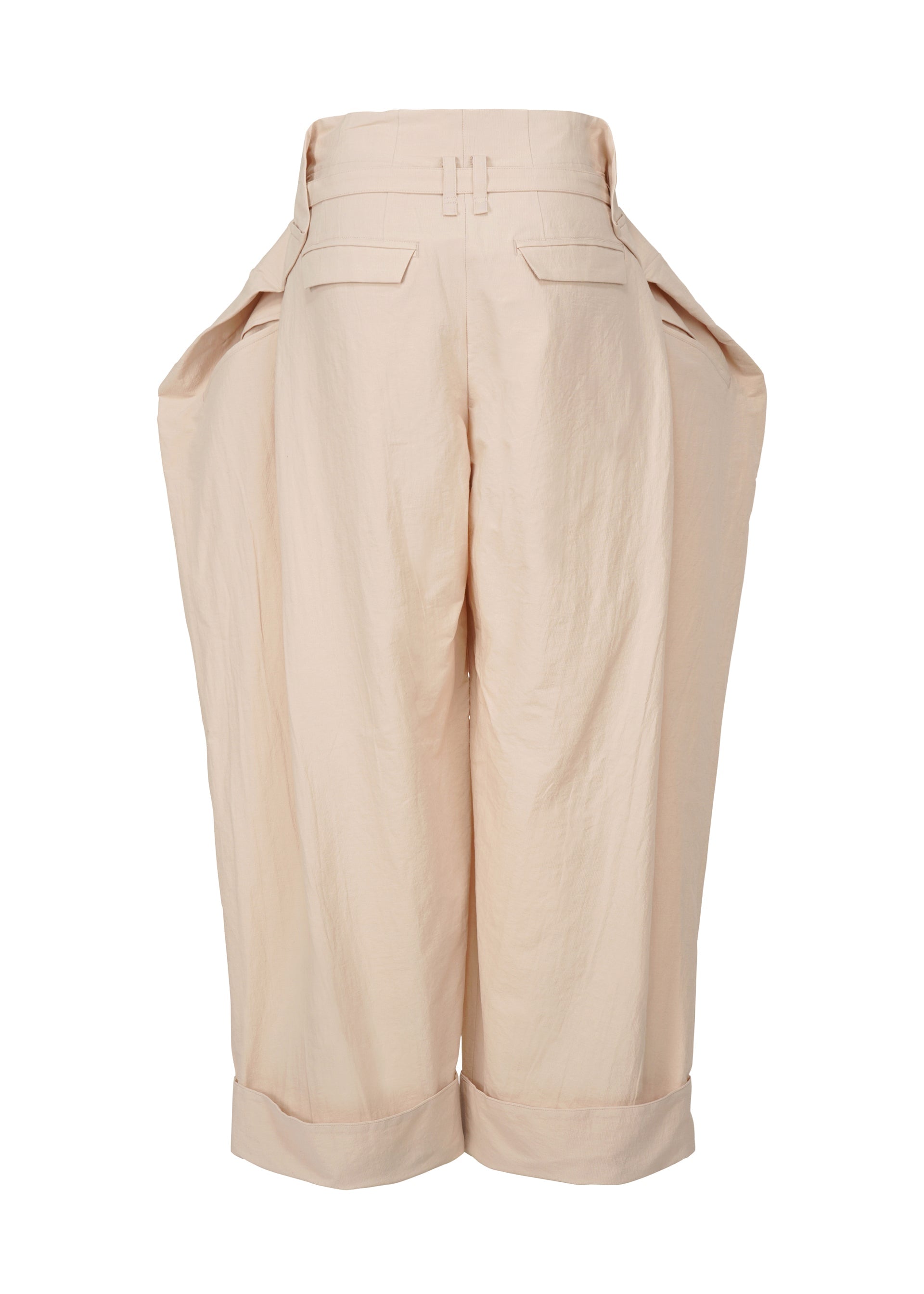 A detail shot of the ISSEY MIYAKE FOLD TO FORM trousers.