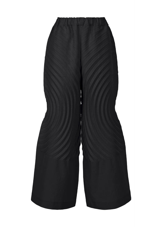 A product shot of the ISSEY MIYAKE FLOW trousers in black (15).