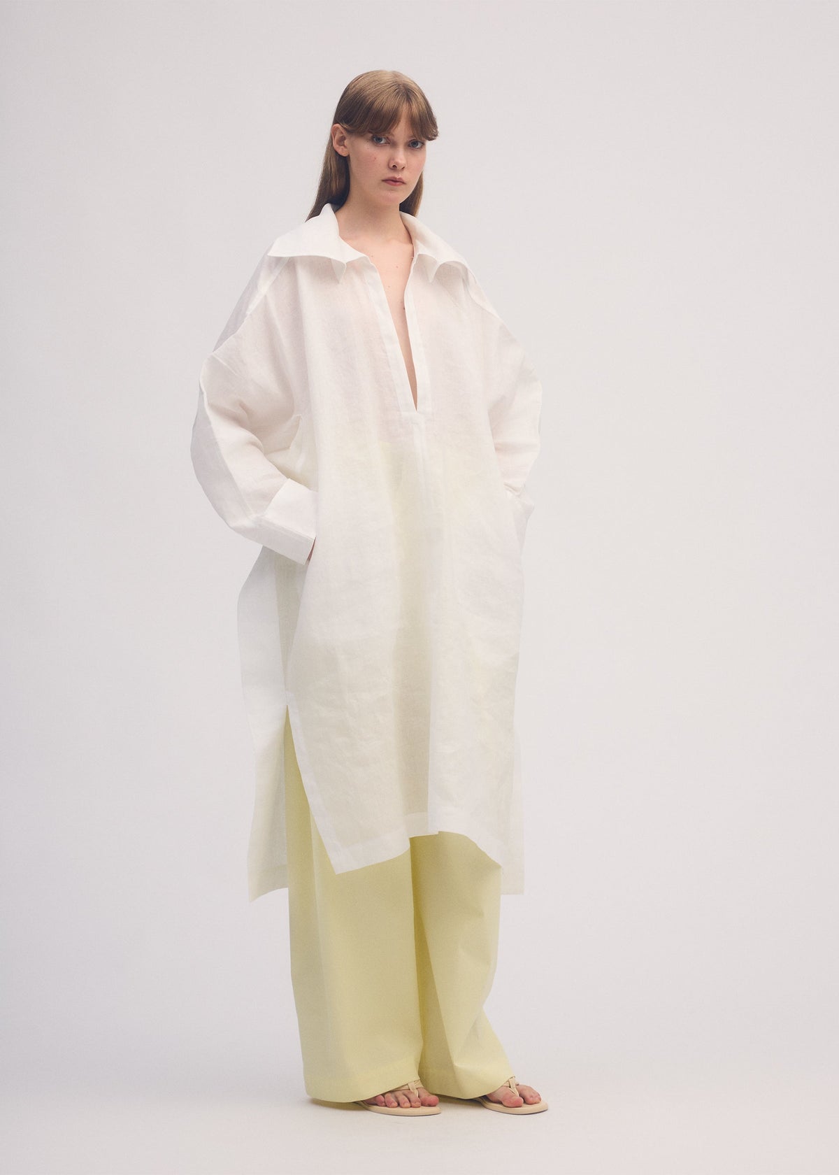 A model wears the ISSEY MIYAKE HEMPEN dress.