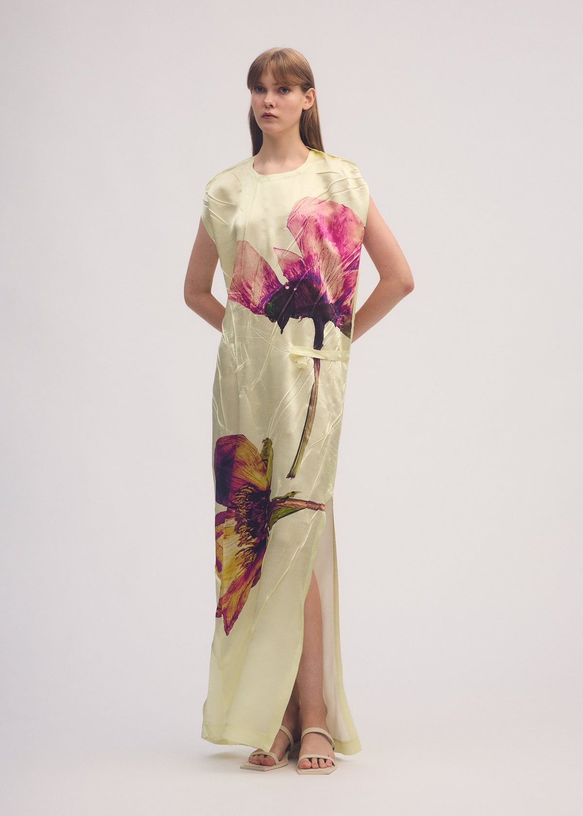 A model wears the ISSEY MIYAKE PRESSED FLORA dress.