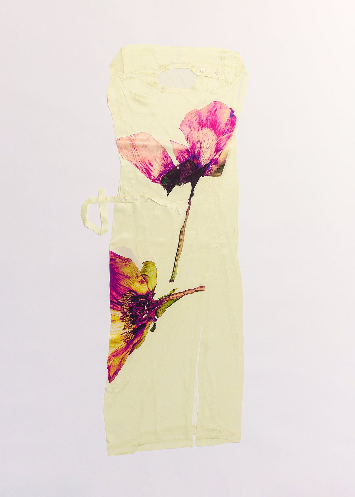 A detail shot of the ISSEY MIYAKE PRESSED FLORA dress.