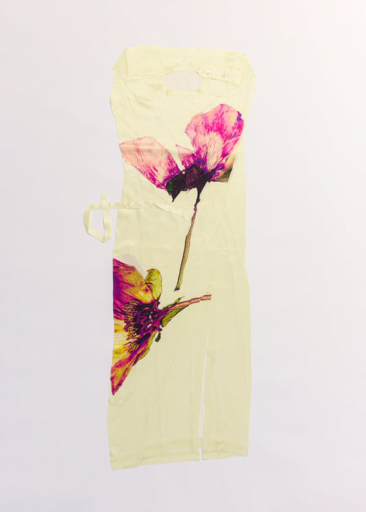 A detail shot of the ISSEY MIYAKE PRESSED FLORA dress.