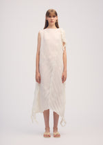 A model wears the ISSEY MIYAKE WRINKLED AND TWISTED dress.