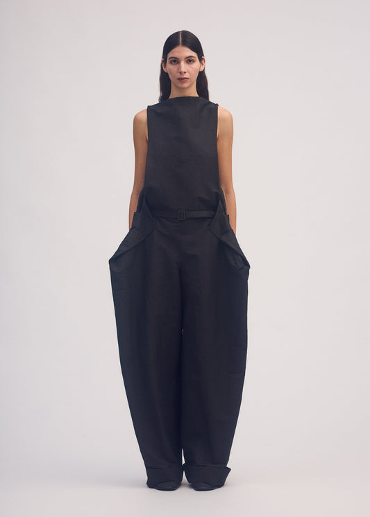 A model wears the ISSEY MIYAKE FOLD TO FORM jumpsuit.