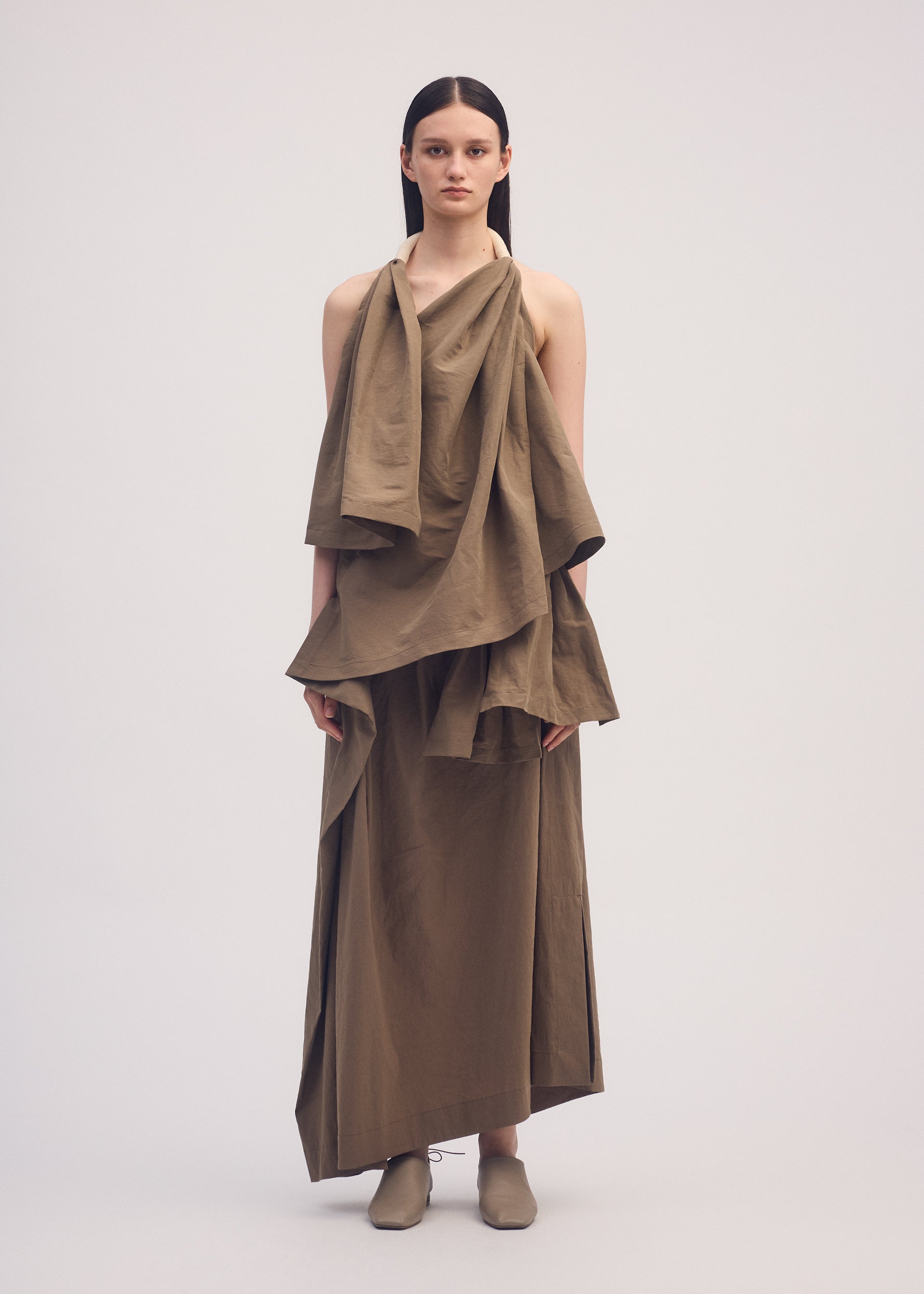 A model wears the ISSEY MIYAKE CLOTH AND CORD shirt.