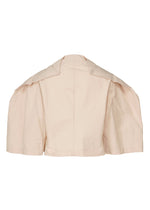 A detail shot of the ISSEY MIYAKE FOLD TO FORM shirt.
