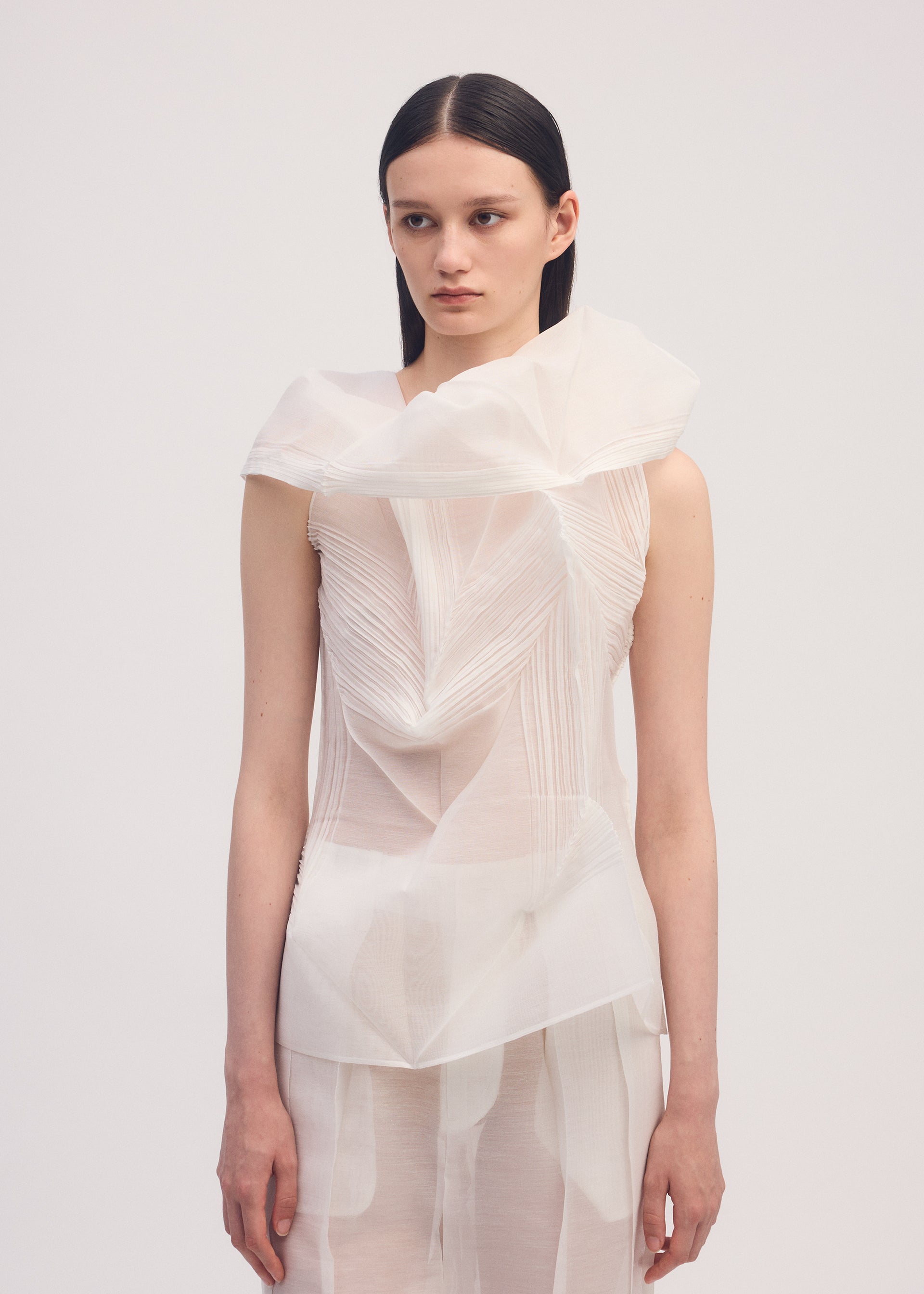 A model wears the ISSEY MIYAKE SHADE AND SHADED shirt.