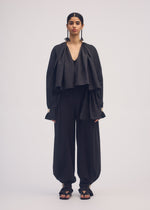 A model wears the ISSEY MIYAKE CLOTH AND CORD cardigan.