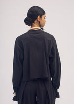 A model wears the ISSEY MIYAKE CLOTH AND CORD cardigan.