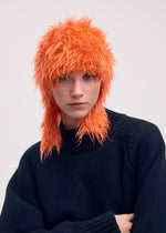A model wears the ISSEY MIYAKE ODD BEANIE hat.