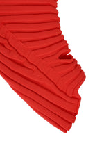 A detail shot of the ISSEY MIYAKE KNIT (AS IT IS) ACC gloves.