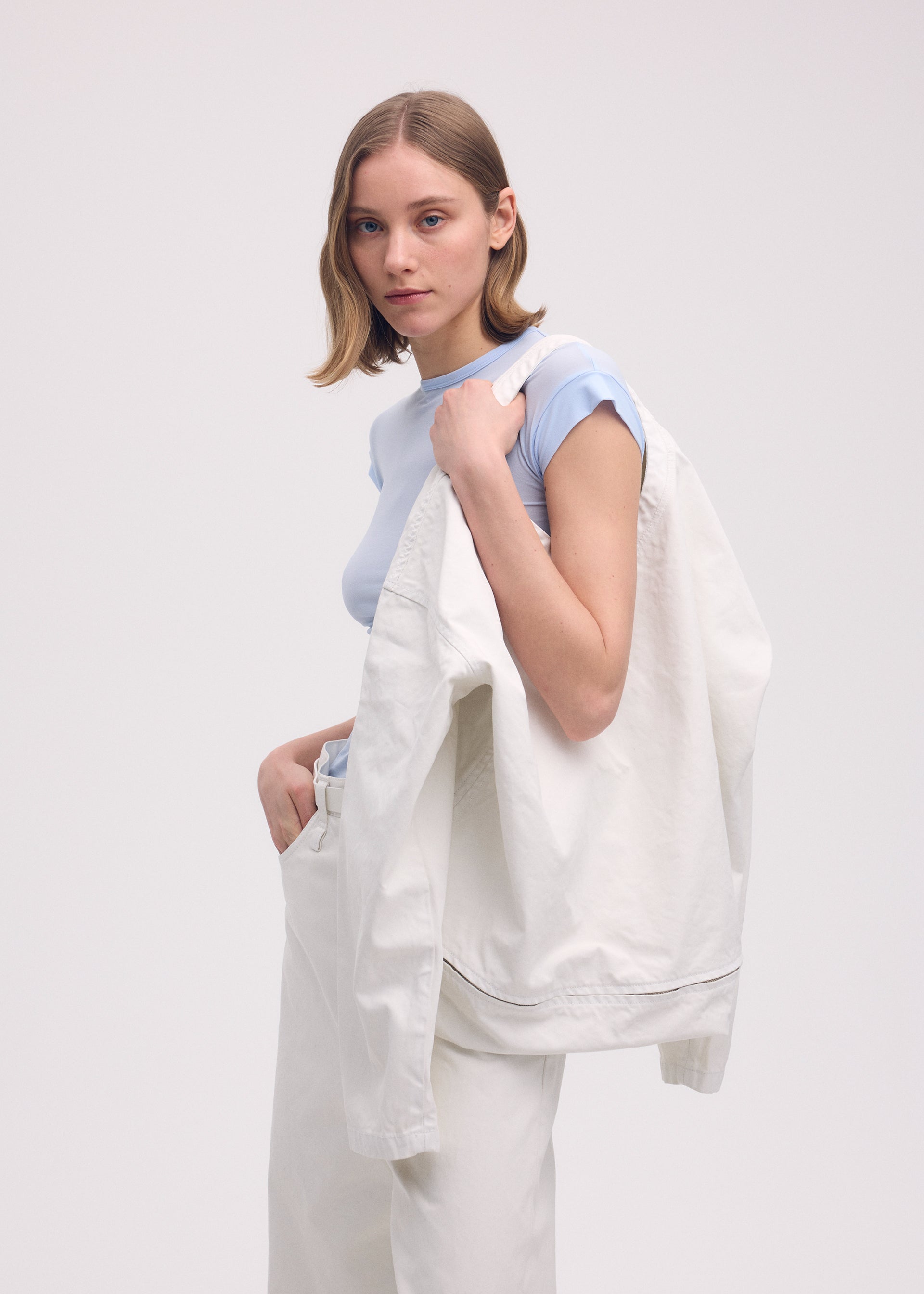 A model wears the ISSEY MIYAKE SCULPTURAL (BAG) bag.