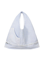A product shot of the ISSEY MIYAKE SCULPTURAL (BAG) bag in light blue.